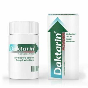 A container of Daktarin Powder displayed on a clear, neutral background. The product is prominently featured in the center, showcasing its branding and the antifungal indication. The container is designed for easy application, highlighting its use for treating fungal infections and providing relief from associated symptoms