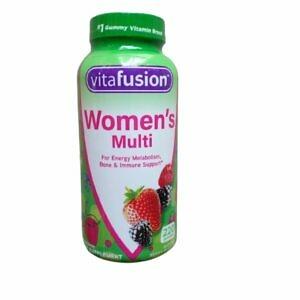 A large bottle of Vitafusion Women's Multivitamin Gummies in Berry Flavor, containing 220 gummies, is presented against a neutral background. The label prominently displays the brand name 'Vitafusion' and specifies that these are women's multivitamin gummies, highlighting the berry flavor. The packaging is colorful and appealing, designed to attract attention and indicate the enjoyable taste and health benefits of the product