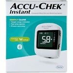 Accu-Chek Instant blood glucose monitor displayed on a clean, white background. The device features a large, easy-to-read digital display showing a glucose reading, with a single test strip inserted into the slot at the bottom. The compact, portable design of the monitor emphasizes its user-friendly interface, with a prominent power button visible. This image highlights the simplicity and accuracy of the device for daily diabetes management.