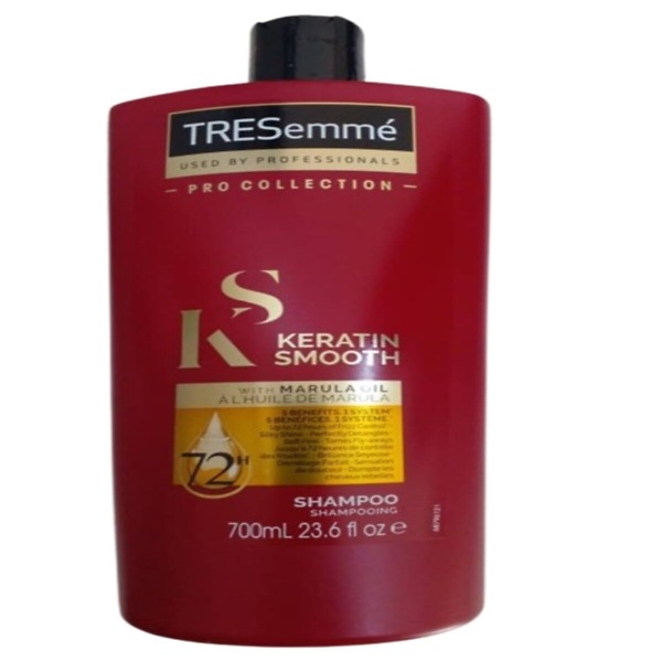 TRESemME Keratin Smooth Shampoo, 700ml bottle with a sleek design, featuring a purple label and white text. The shampoo is formulated with keratin and marula oil to smooth frizz and add shine to hair. Perfect for frizzy and unmanageable hair types.